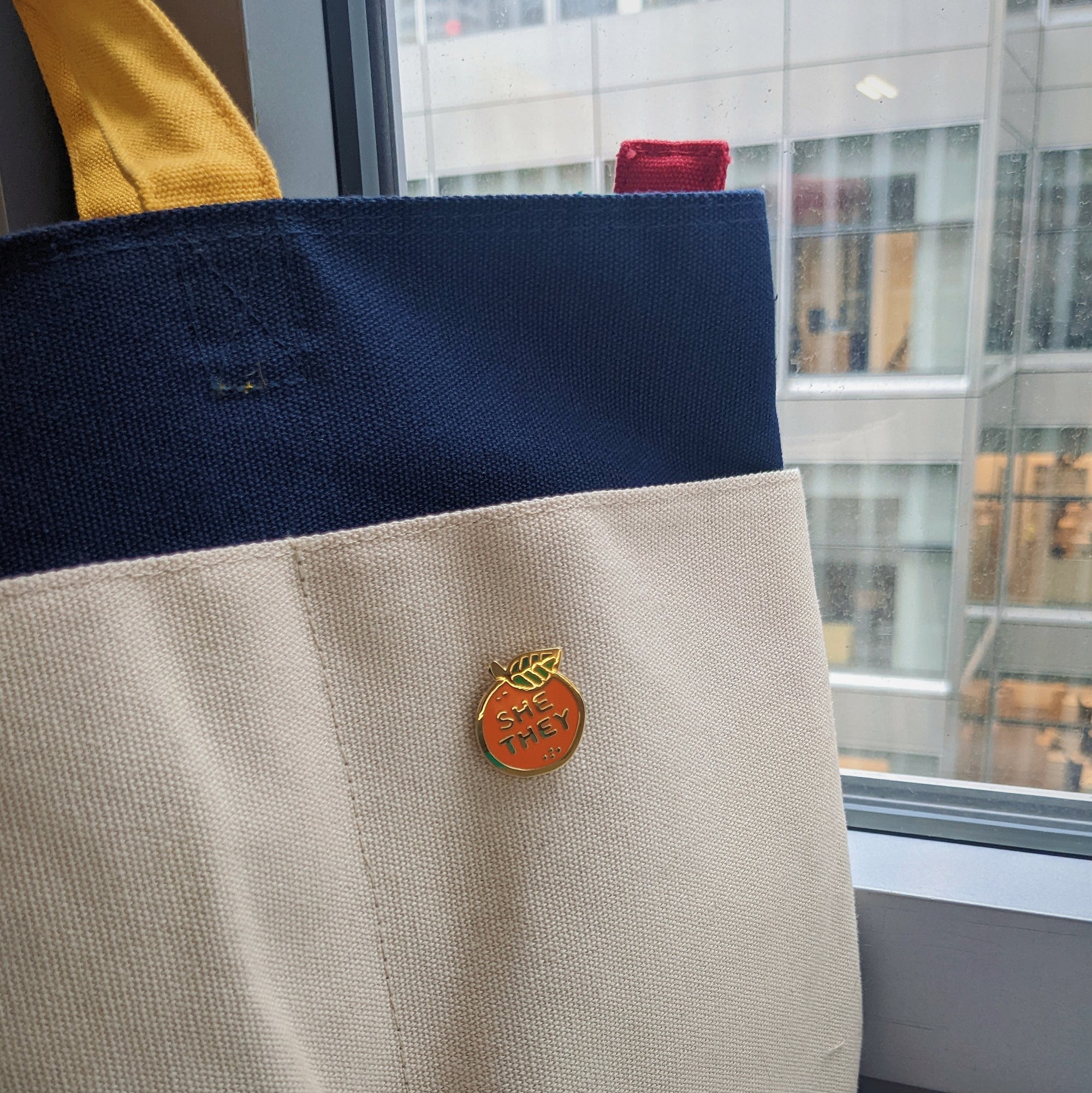 Pronoun Orange Pin - he/they