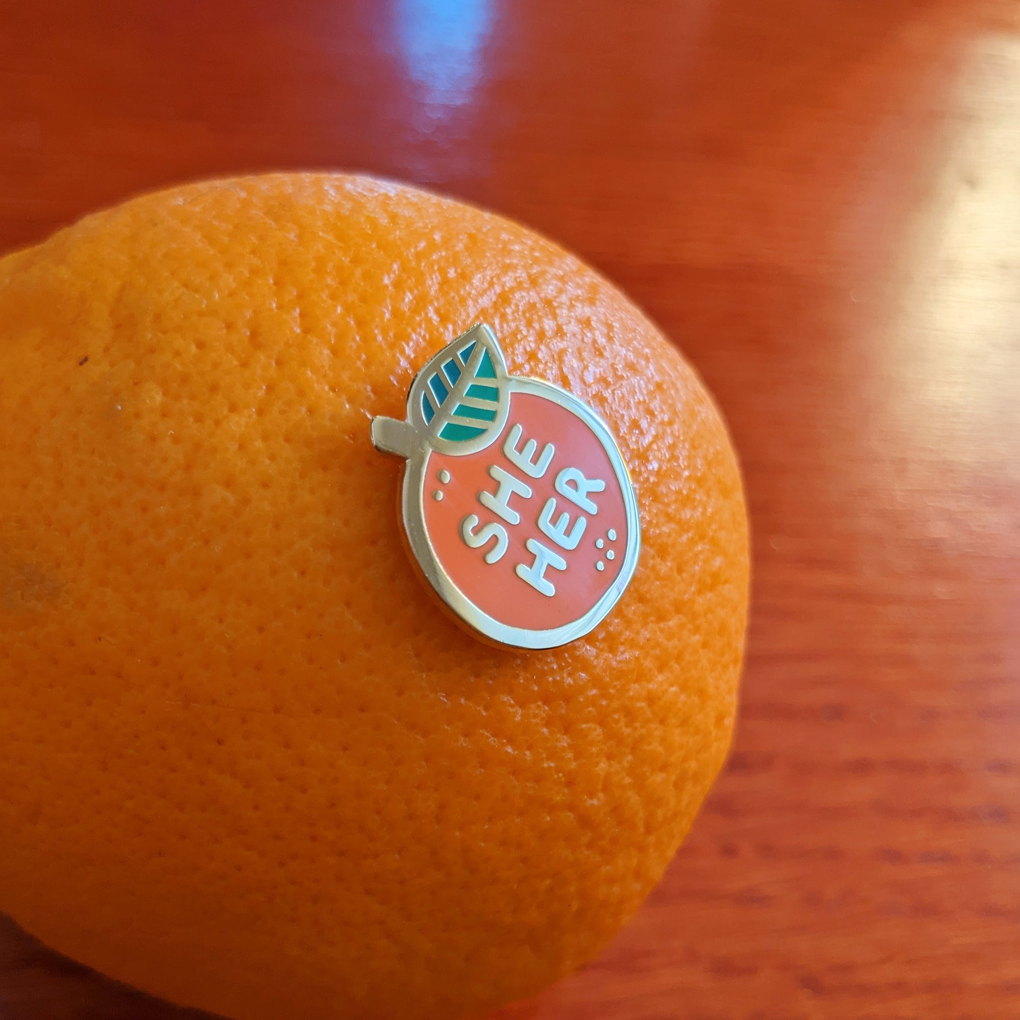 Pronoun Orange Pin - she/her